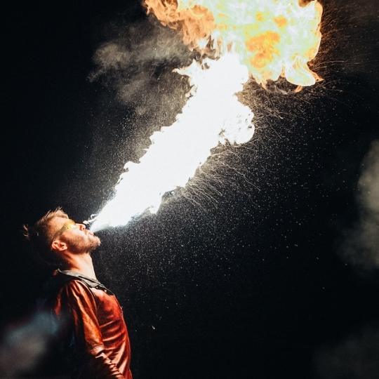 fire performer breathing fire